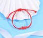 Red BFF bracelet on a table shell