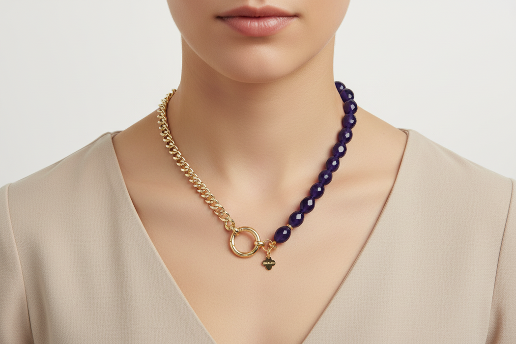 Necklace with gold chain and blue beads on a women