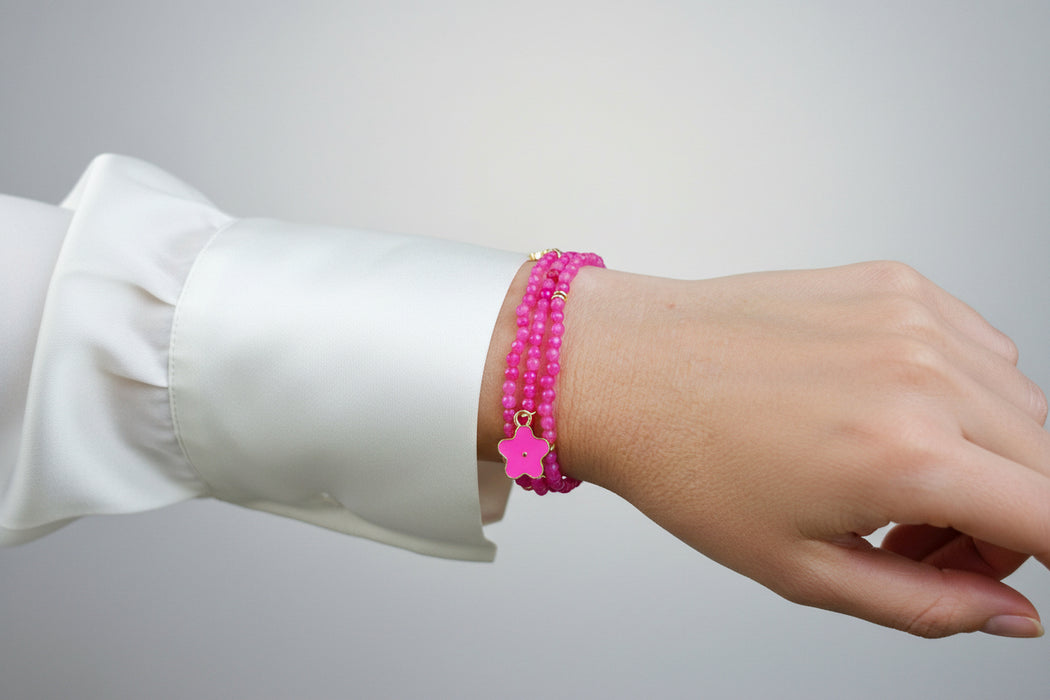 hot pink bead bracelet on ladys hand