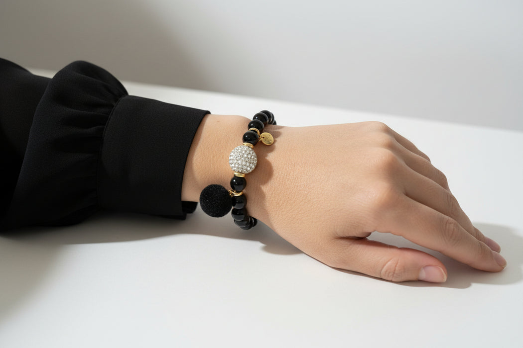 lady wearing black bead bracelet 