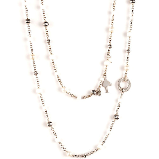 silver necklace with white and silver jewels and silver charms