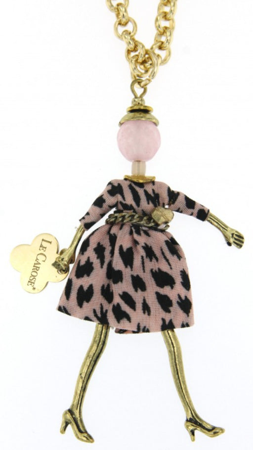 long gold chain necklace with carosina doll pendant wearing pink spotty dress 