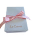 white gift box with pink ribbon